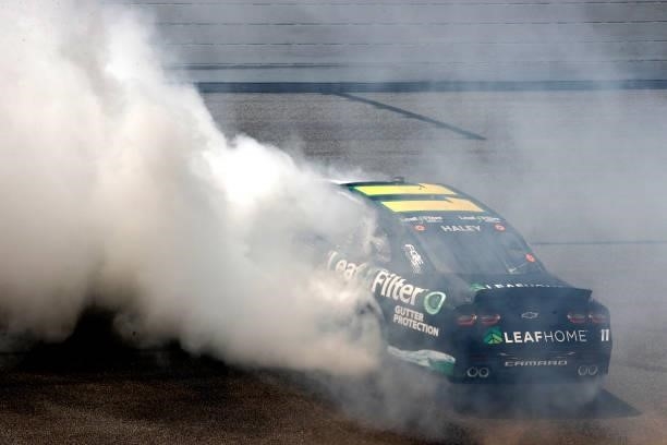 Justin Haley, driver of the LeafFilter Gutter Protection Chevrolet, celebrates with a burnout after winning the NASCAR Xfinity Series Wawa 250 at...