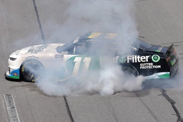 Justin Haley, driver of the LeafFilter Gutter Protection Chevrolet, celebrates with a burnout after winning the NASCAR Xfinity Series Wawa 250 at...
