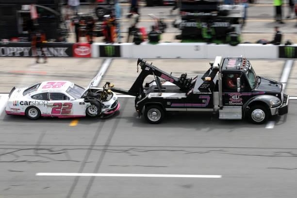 The Car Shop Ford, driven by Austin Cindric is towed off pit road after an on-track incident during the NASCAR Xfinity Series Wawa 250 at Daytona...