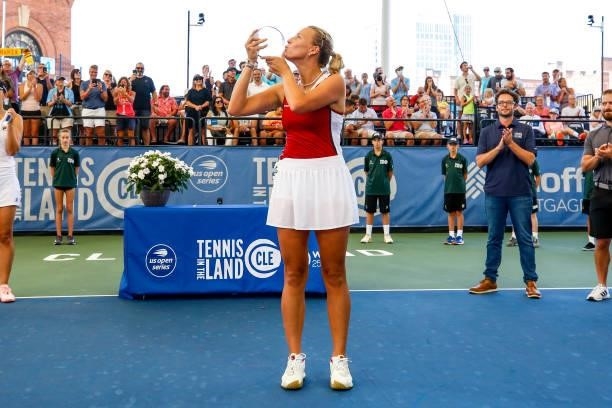 Anett Kontaveit of Estonia kisses her trophy after winning her finals match against Irina-Camelia Begu of Romania on day 7 of the Cleveland...