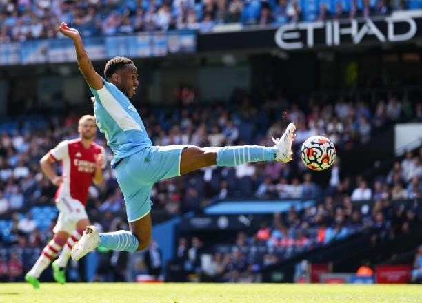Raheem Sterling of Manchester City in action during the Premier League match between Manchester City and Arsenal at Etihad Stadium on August 28, 2021...