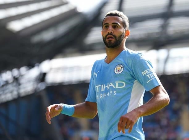 Riyad Mahrez of Manchester City in action during the Premier League match between Manchester City and Arsenal at Etihad Stadium on August 28, 2021 in...