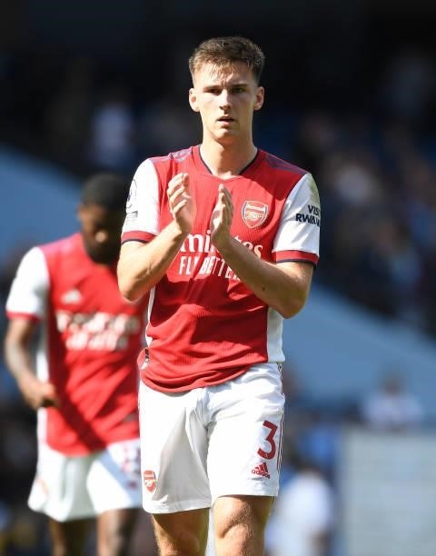 Kieran Tierney applauds the Arsenal fans after the Premier League match between Manchester City and Arsenal at Etihad Stadium on August 28, 2021 in...