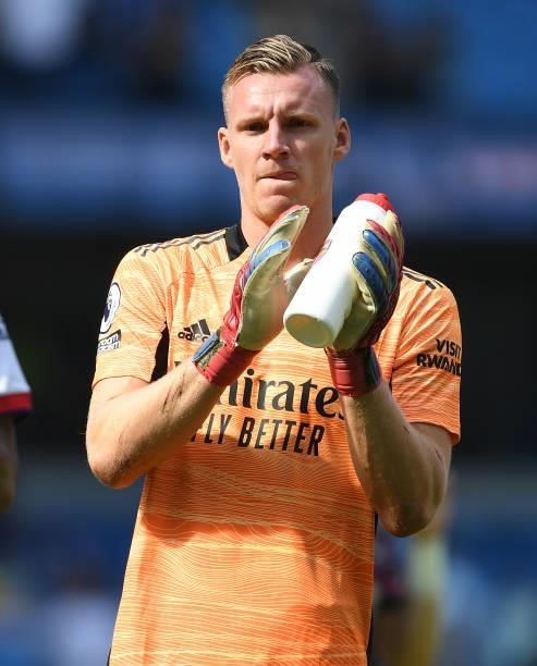 Bernd Leno applauds the Arsenal fans after the Premier League match between Manchester City and Arsenal at Etihad Stadium on August 28, 2021 in...