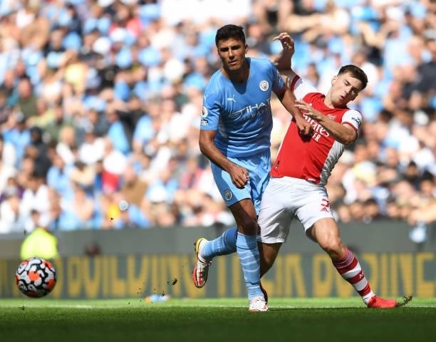 Kieran Tierney of Arsenal fouled by Rodri of Man City during the Premier League match between Manchester City and Arsenal at Etihad Stadium on August...