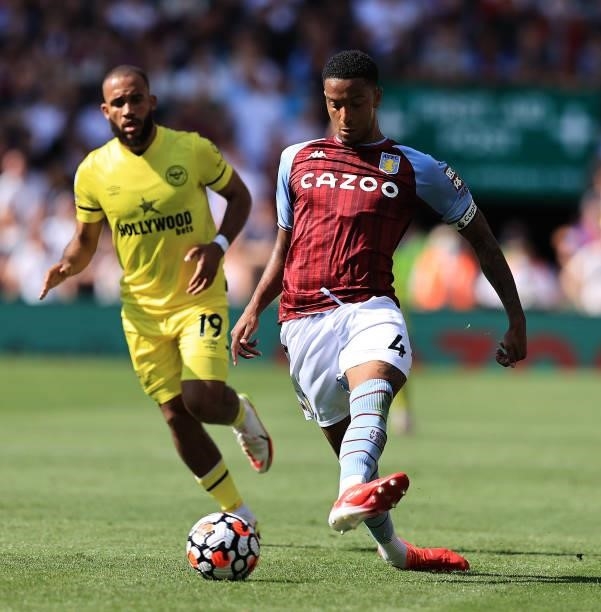 Ezri Konsa of Aston Villa passes the ball during the Premier League match between Aston Villa and Brentford at Villa Park on August 28, 2021 in...