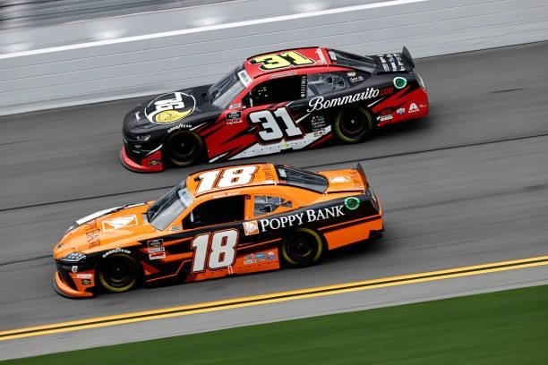 Daniel Hemric, driver of the Poppy Bank Toyota, and Jordan Anderson, driver of the Bommarito Automotive Group Chevrolet, race during the NASCAR...