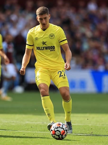 Vitaly Janelt of Brentford runs with the ball during the Premier League match between Aston Villa and Brentford at Villa Park on August 28, 2021 in...