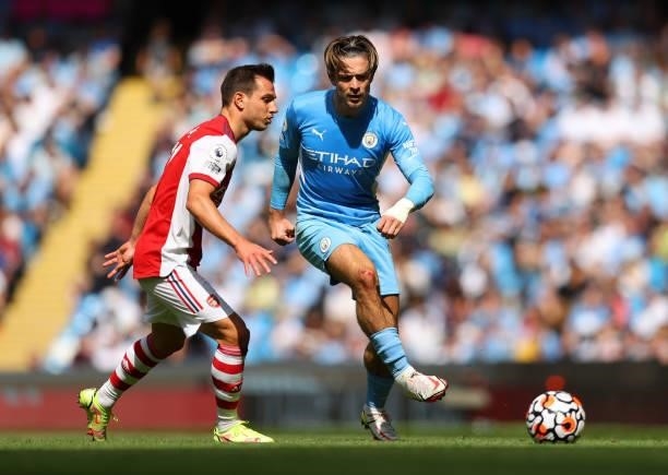 Jack Grealish of Manchester City and Cedric Soares of Arsenal during the Premier League match between Manchester City and Arsenal at Etihad Stadium...