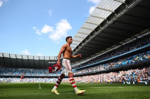 Cedric Soares of Arsenal goes to give his shirt away after the Premier League match between Manchester City and Arsenal at Etihad Stadium on August...