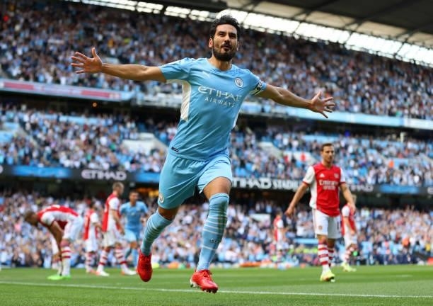 Ilkay Gundogan of Manchester City celebrates scoring the first goal during the Premier League match between Manchester City and Arsenal at Etihad...