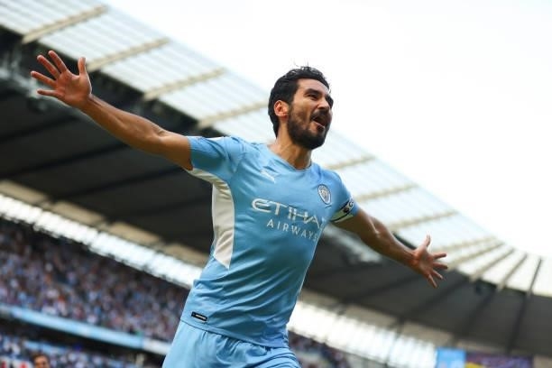 Ilkay Gundogan of Manchester City celebrates scoring the first goal during the Premier League match between Manchester City and Arsenal at Etihad...