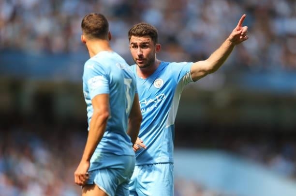 Aymeric Laporte of Manchester City talks to Ruben Dias of Manchester City during the Premier League match between Manchester City and Arsenal at...