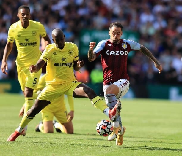 Danny Ings of Aston Villa is challenged by Yoane Wissa during the Premier League match between Aston Villa and Brentford at Villa Park on August 28,...