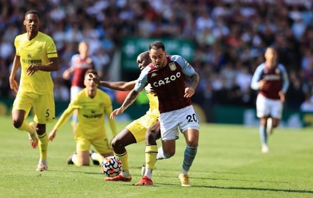 Danny Ings of Aston Villa is challenged by Yoane Wissa during the Premier League match between Aston Villa and Brentford at Villa Park on August 28,...