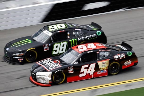 Christopher Bell, driver of the Reser's Fine Foods Toyota, and Riley Herbst, driver of the Monster Energy Ford, race during the NASCAR Xfinity Series...