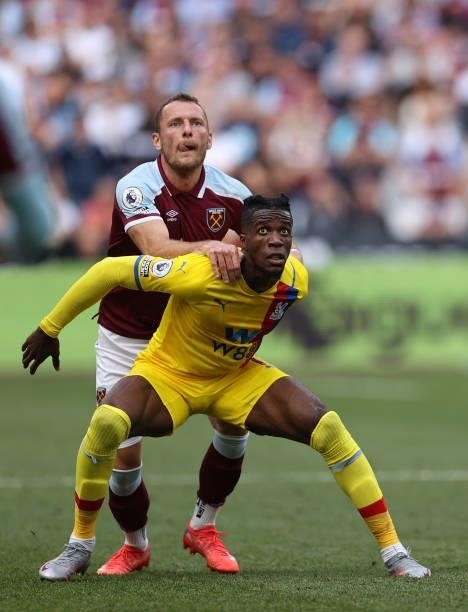 Wilfried Zaha of Crystal Palace is marked by Vladimir Coufal of West Ham United during the Premier League match between West Ham United and Crystal...