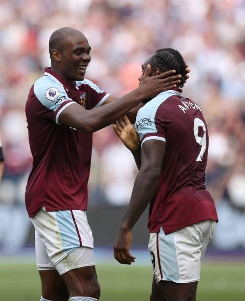 Michail Antonio of West Ham United is congratulated on his first goal by Angelo Ogbonna during the Premier League match between West Ham United and...