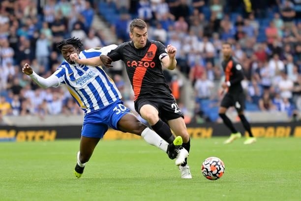 Seamus Coleman of Everton and Taylor Richards challenge for the ball. During the Premier League match between Brighton & Hove Albion and Everton at...