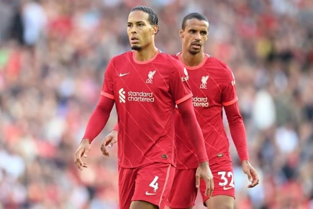 Virgil van Dijk and Joel Matip of Liverpool in action during the Premier League match between Liverpool and Chelsea at Anfield on August 28, 2021 in...