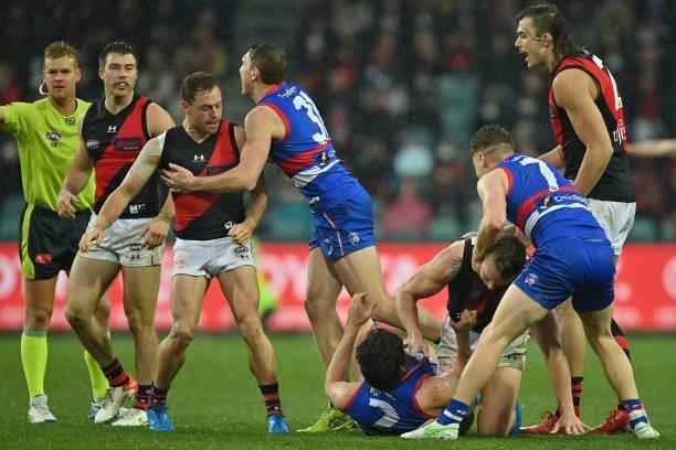 Jake Stringer of the Bombers and Lewis Young of the Bulldogs wrestle during the AFL First Elimination Final match between Western Bulldogs and...