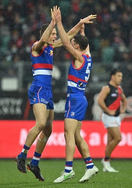 Josh Schache of the Bulldogs is congratulated by Josh Dunkley after kicking a goal during the AFL First Elimination Final match between Western...