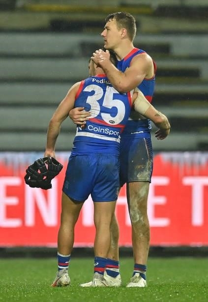 Caleb Daniel and Jackson Macrae of the Bulldogs celebrate winning the AFL First Elimination Final match between Western Bulldogs and Essendon Bombers...