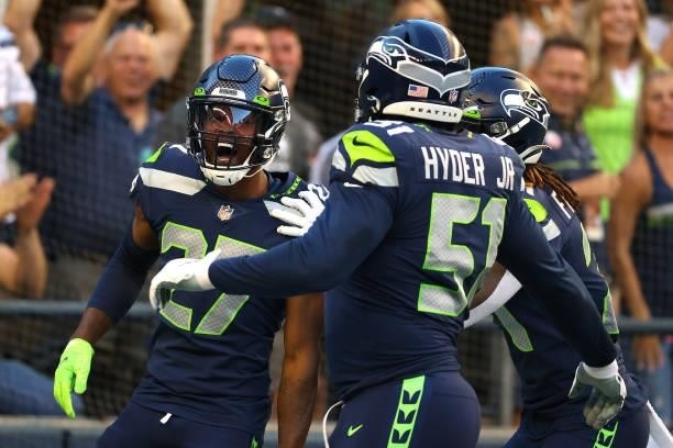 Marquise Blair of the Seattle Seahawks celebrates after returning a 17 yard fumble for a touchdown against the Los Angeles Chargers in the first...