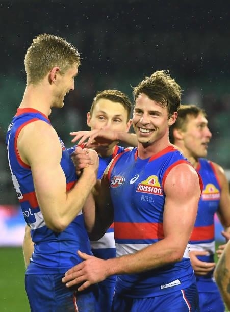 Tim English and Mitch Hannan of the Bulldogs celebrate winning the AFL First Elimination Final match between Western Bulldogs and Essendon Bombers at...