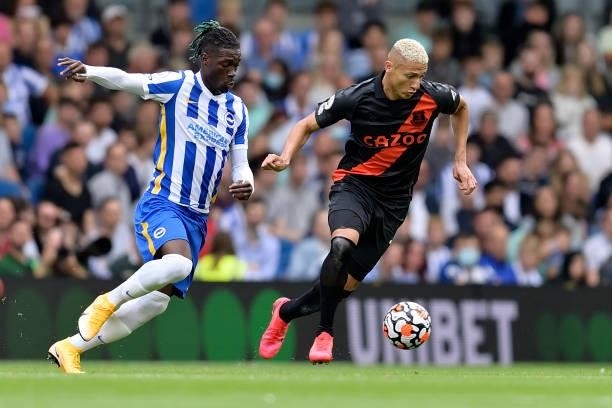 Richarlison of Everton and Yves Bissouma challenge for the ball during the Premier League match between Brighton & Hove Albion and Everton at...
