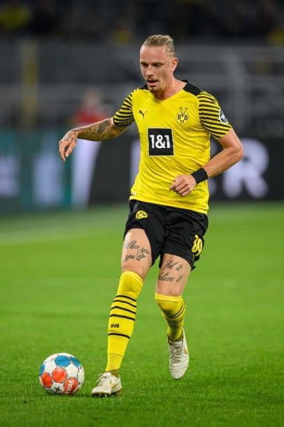 Marius Wolf of Dortmund runs with the ball during the Bundesliga match between Borussia Dortmund and TSG Hoffenheim at Signal Iduna Park on August...