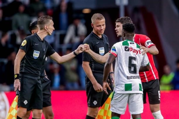 Assistant referee Johan Balder, assistant referee Joost van Zuilen, Marco van Ginkel of PSV during the Dutch Eredivisie match between PSV and FC...