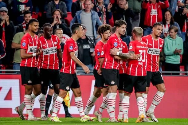 Andre Ramalho of PSV celebrates his goal with his teammates during the Dutch Eredivisie match between PSV and FC Groningen at Philips Stadion on...