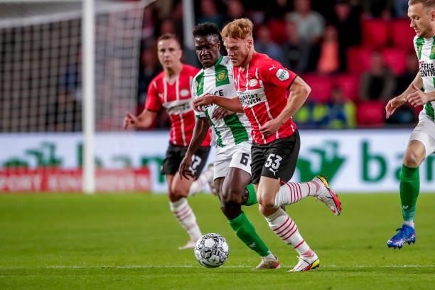 Azor Matusiwa of FC Groningen, Yorbe Vertessen of PSV during the Dutch Eredivisie match between PSV and FC Groningen at Philips Stadion on August 28,...