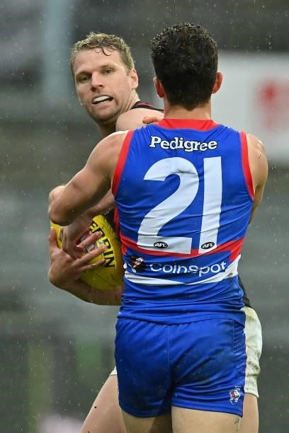 Jake Stringer of the Bombers is tackled by Tom Liberatore of the Bulldogs during the AFL First Elimination Final match between Western Bulldogs and...
