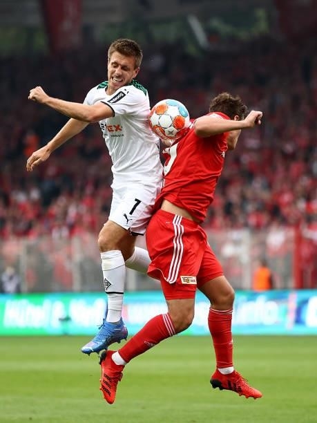 Patrick Herrmann of Borussia Moenchengladbach challenges for the high ball with Max Kruse of 1.FC Union Berlin during the Bundesliga match between 1....