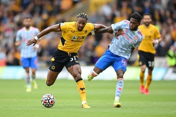 Adama Traore of Wolverhampton Wanderers battles for possession with Fred of Manchester United during the Premier League match between Wolverhampton...