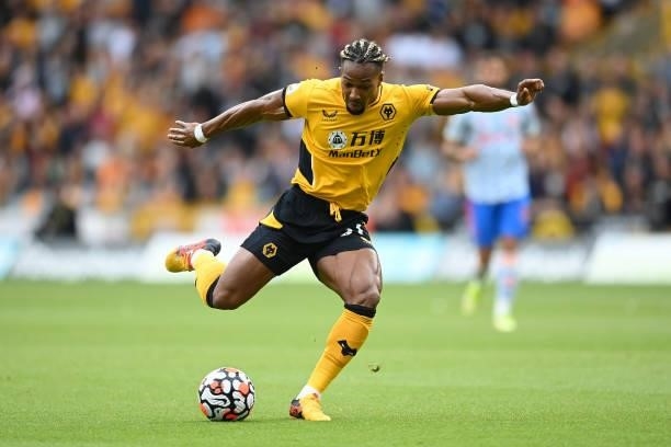 Adama Traore of Wolverhampton Wanderers runs with the ball during the Premier League match between Wolverhampton Wanderers and Manchester United at...