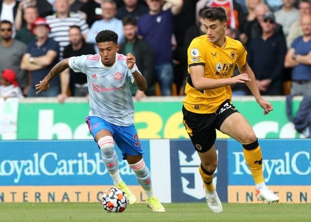 Jadon Sancho of Manchester United in action with Max Kilman of Wolverhampton Wanderers during the Premier League match between Wolverhampton...