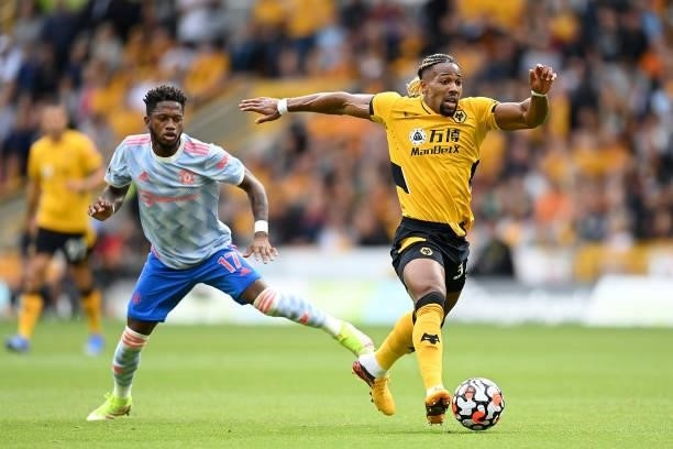 Adama Traore of Wolverhampton Wanderers battles for possession with Fred of Manchester United during the Premier League match between Wolverhampton...
