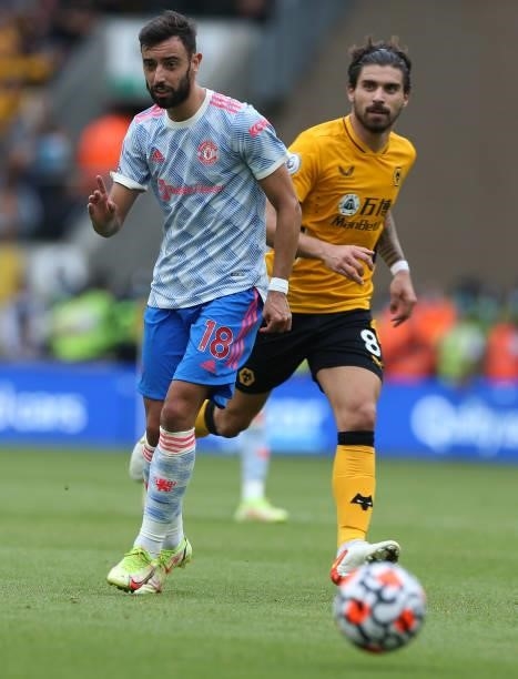 Bruno Fernandes of Manchester United in action with Ruben Neves of Wolverhampton Wanderers during the Premier League match between Wolverhampton...