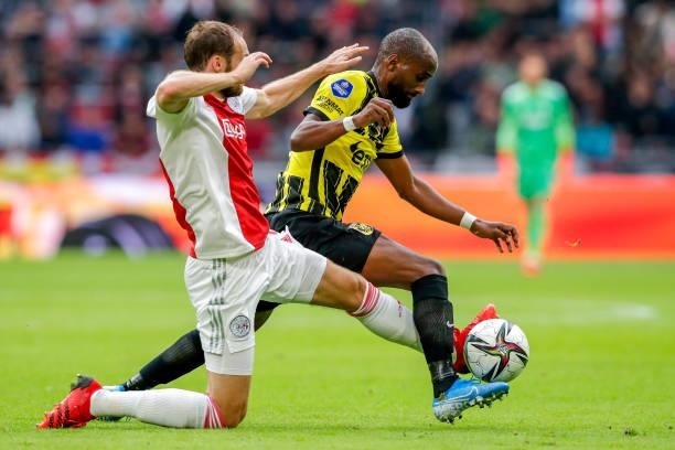 Daley Blind of Ajax, Eli Dasa of Vitesse during the Dutch Eredivisie match between Ajax and Vitesse at Johan Cruijff ArenA on August 29, 2021 in...