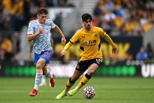 Francisco Trincao of Wolverhampton Wanderers battles for possession with Daniel James of Manchester United during the Premier League match between...