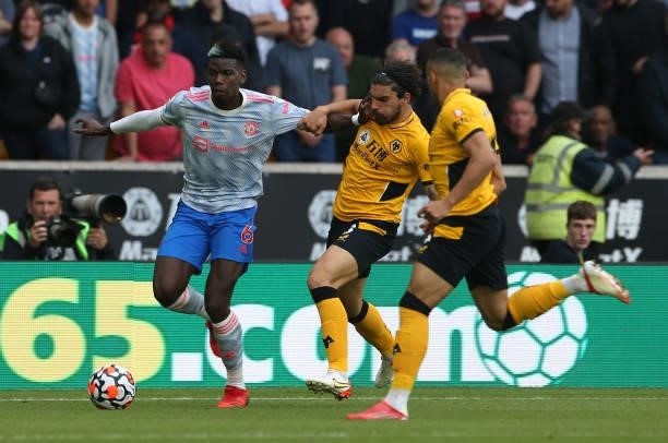 Paul Pogba of Manchester United in action with Ruben Neves of Wolverhampton Wanderers during the Premier League match between Wolverhampton Wanderers...