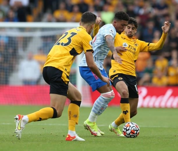 Jadon Sancho of Manchester United in action with Francisco Trincao of Wolverhampton Wanderers during the Premier League match between Wolverhampton...