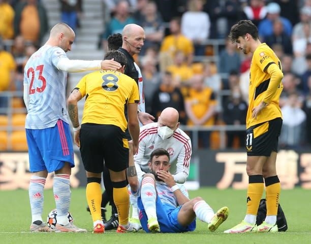 Bruno Fernandes of Manchester United lies injured during the Premier League match between Wolverhampton Wanderers and Manchester United at Molineux...