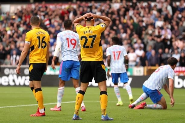 Romain Saiss of Wolverhampton Wanderers reacts after a missed chance during the Premier League match between Wolverhampton Wanderers and Manchester...