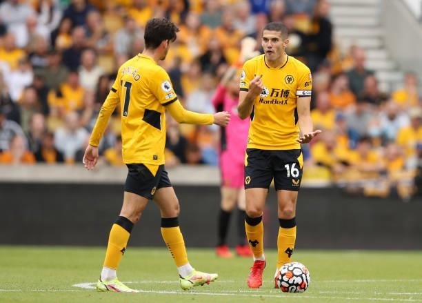 Francisco Trincao and Conor Coady of Wolverhampton Wanderers interact during the Premier League match between Wolverhampton Wanderers and Manchester...