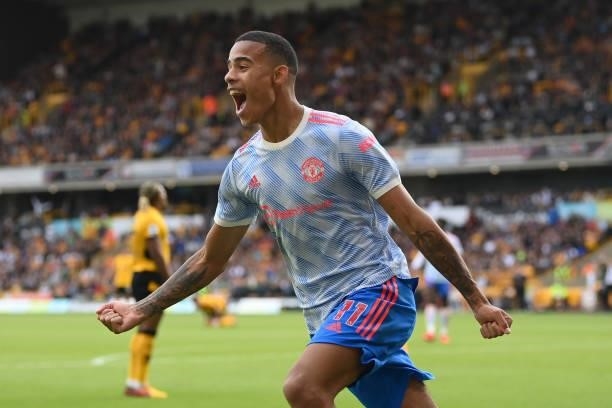 Mason Greenwood of Manchester United celebrates after scoring their sides first goal during the Premier League match between Wolverhampton Wanderers...