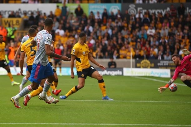 Mason Greenwood of Manchester United scores the opening goal during the Premier League match between Wolverhampton Wanderers and Manchester United at...